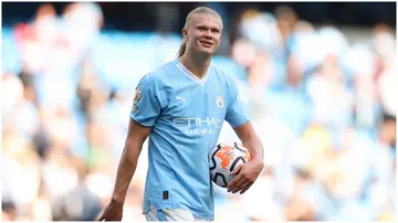 Erling Haaland carries the match ball after scoring a hat-trick during the Premier League match between Manchester City and Fulham FC at Etihad Stadium. Photo by Lewis Storey.