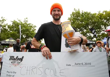 Chris Cole poses with award won in 2010