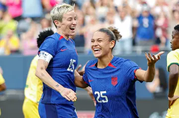 US forward Trinity Rodman, right, celebrates scoring a goal with teammate Megan Rapinoe, left, during a football friendly against South Africa at Chicago