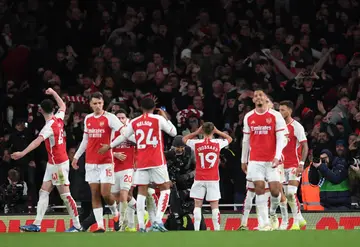 Arsenal players celebrate after scoring their 3rd goal during the Premier League match against Liverpool FC 
