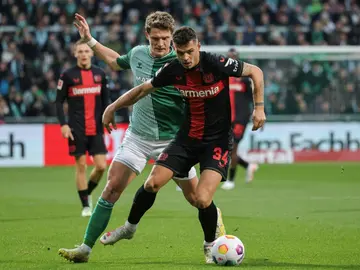 Granit Xhaka (R) joined Bayer Leverkusen from Arsenal in the close season