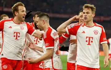 Joshua Kimmich (R) celebrates scoring Bayern's winner against Arsenal