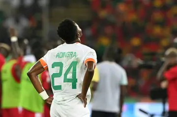 Ivory Coast forward Simon Adingra appears dejected at the end of his team's humiliating 4-0 loss to Equatorial Guinea on Monday