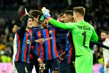 Barcelona's players celebrate at the end of the Copa del Rey first leg victory over Real Madrid