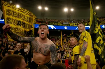 Marco Reus (R) celebrates Borussia Dortmund reaching the Champions League final with fans