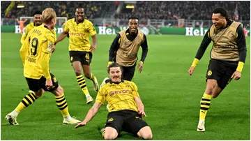 Dortmund's Marcel Sabitzer celebrates with his teammates after scoring during their Champions League quarter-final clash against Atletico Madrid. Photo by Bernd Thissen.