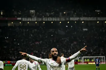 Alexandre Lacazette celebrates his winning goal for Lyon against Marseille