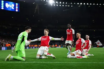 Arsenal celebrate their penalty shootout win over Porto in the UEFA Champions League Round of 16 second leg.