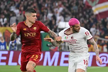 Roma's Gianluca Mancini  with Milan's Theo Hernandez in their 1-1- draw