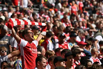 Arsenal fans sing ahead of kick-off in the English FA Community Shield football match between Arsenal and Manchester City at Wembley Stadium, in London
