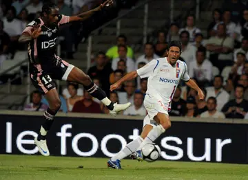 Fabio Grosso (R) won Ligue 1 and the French Cup as a defender with Lyon in 2008