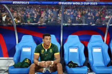 Kurt-Lee Arendse looks on from the substitutes bench at full-time