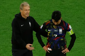 Jurgen Klinsmann and Son Heung-min after a defeat in Qatar