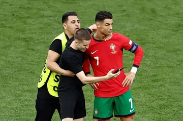 Several pitch invaders tried to take selfies with Cristiano Ronaldo during the win over Turkey on Saturday