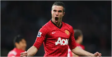 Robin van Persie celebrates scoring the opening goal during the Premier League match between Manchester United and Aston Villa at Old Trafford. Photo by Alex Livesey.