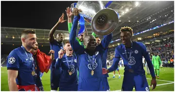 Ngolo Kante celebrates with the Champions League trophy following their team's victory during the UEFA Champions League Final between Man City and Chelsea at Estadio do Dragao. Photo by David Ramos.