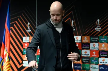 Manchester United manager Erik ten Hag arrives for a press conference ahead of the clash with Barcelona