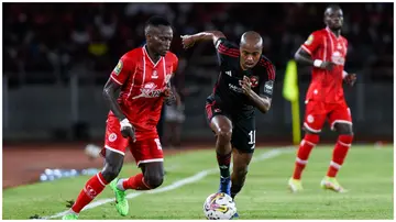 Percy Tau (centre) in action for Al Ahly aganst Simba SC in the first leg of the CAF Champions League quarter-final. Photo: Al Ahly SC.