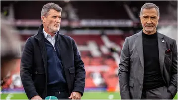 Graeme Souness and Roy Keane look on prior to the Emirates FA Cup Quarter Final match between Manchester United and Liverpool at Old Trafford. Photo by Ash Donelon.