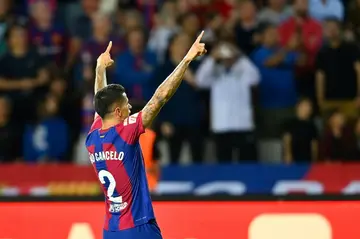 Joao Cancelo netted an 89th minute winner as Barcelona went provisionally top of the league ahead of Girona and rivals Real Madrid