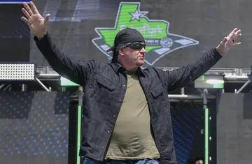 Professional wrestler The Undertaker walks onstage