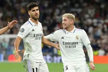 Late double:  Marco Asensio (L) is congratulated by Fede Valverde after scoring Real Madrid's second goal