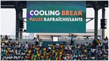 A billboard reading "cooling break" is seen during the Africa Cup of Nations 2023 Group C match between Senegal and Cameroon. Photo: KENZO TRIBOUILLARD.