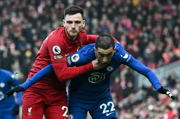 Batting to a draw: Liverpool defender Andrew Robertson (L) grapples with Chelsea midfielder Hakim Ziyech on another frustrating afternoon for both clubs