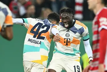 Jamal Musiala (L) and Alphonso Davies both scored in Bayern's 5-2 win over Augsburg
