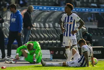 Hertha Berlin players react after their relegation to the second division was confirmed in May