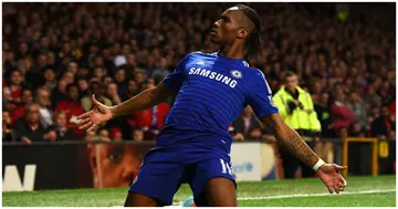 Didier Drogba celebrates scoring the first goal during the Barclays Premier League match between Manchester United and Chelsea at Old Trafford. Photo by Laurence Griffiths.