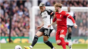 Fulham's Andreas Pereira in action against Liverpool's Harvey Elliott during their Premier League match at Craven Cottage. Photo by Zac Goodwin.