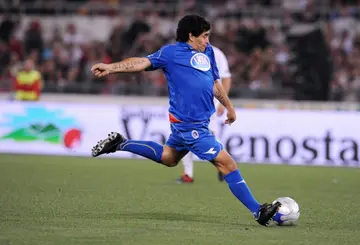 Argentinean football legend Diego Maradona plays at the Rome Olympic stadium during a charity football match on May 12, 2008