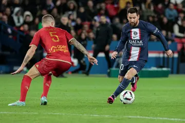 Lionel Messi (R) in action for PSG in their game against Angers