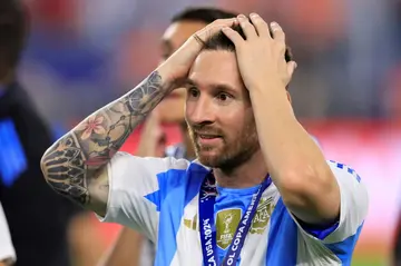 Lionel Messi, reacting after Argentina's victory in Sunday's Copa America final, will miss two MLS matches this week for Inter Miami with an ankle injury, coach Gerardo Martino said