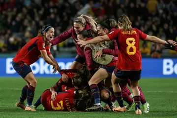 Spain players celebrate Olga Carmona's winning goal against Sweden