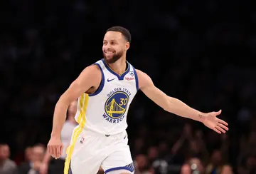 Stephen Curry of the Golden State Warriors celebrates a basket against the Brooklyn Nets