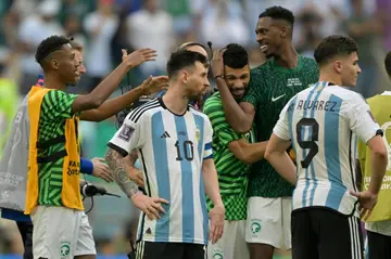 A forlorn Lionel Messi (centre) looks stunned after Saudi Arabia's shock 2-1 World Cup win over Argentina in Qatar