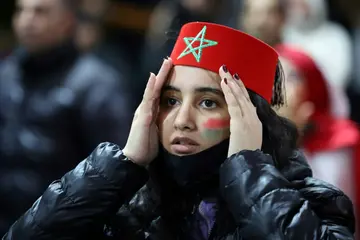 A Morocco supporter in Casablanca watches in despair as France ended her country's hopes of reaching the final