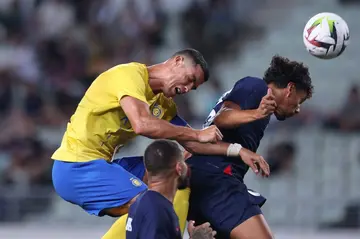 Al Nassr's Cristiano Ronaldo fights for the ball with Paris Saint-Germain's Marquinhos during their 0-0 draw in a friendly in Osaka