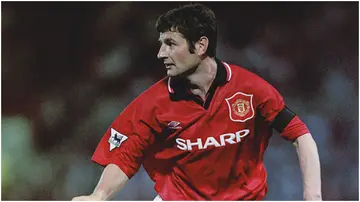 Irish footballer Denis Irwin in action for Manchester United against West Ham at Old Trafford. Photo by Clive Brunskill.