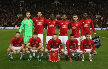 The Manchester United team lines up ahead of the UEFA Europa League match