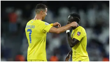 Cristiano Ronaldo and Sadio Mane prepare to embrace after another goal for Al-Nassr during a Saudi Pro League encounter.