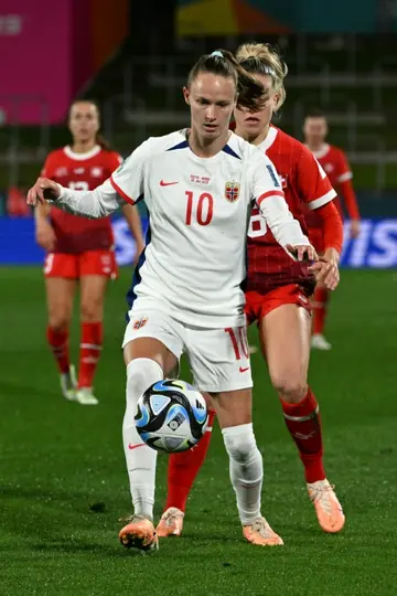 Caroline Graham Hansen holds off Switzerland's Nadine Riesen after coming off the bench during the 0-0 draw between the sides in Hamilton on Tuesday