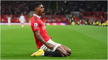 Marcus Rashford celebrates after scoring during the Premier League match between Manchester United and Liverpool at Old Trafford. Photo by Michael Regan.