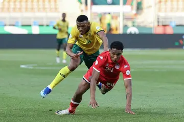Zamalek forward Seifeddine Jaziri (R) falls while playing for Tunisia against South Africa at the 2024 Africa Cup of Nations in the Ivory Coast.
