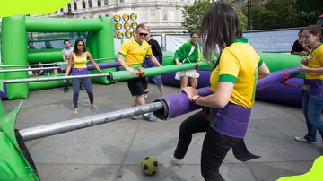 Brazilians playing foosball during celebrations