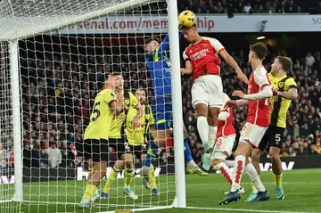 Arsenal defender William Saliba (C) scores against Burnley