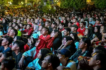 Indonesian football fans watch the semi-final match against Uzbekistan