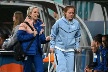 England midfielder Keira Walsh walks with crutches after the Denmark match